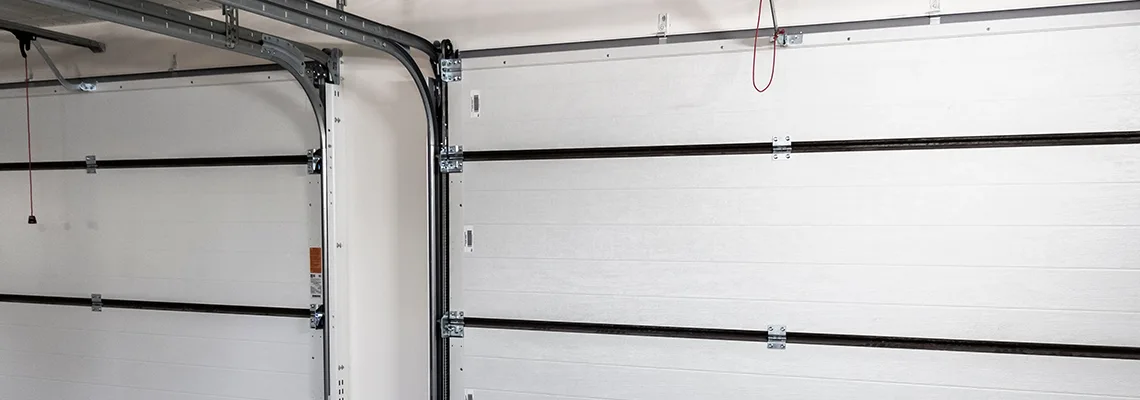 Fix Folding Garage Door Jerking in Edmonton, Alberta